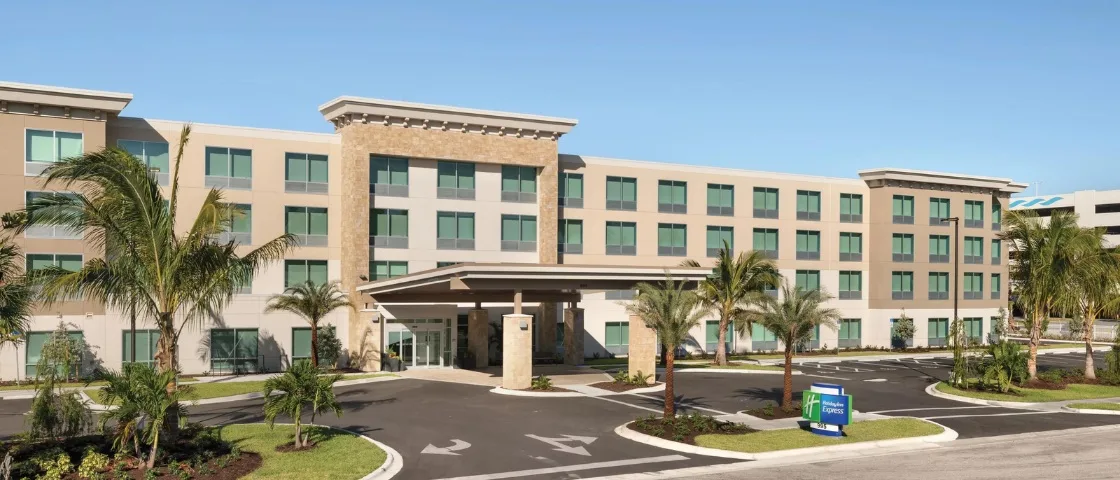 Holiday Inn Express — Hotel entrance with palm trees